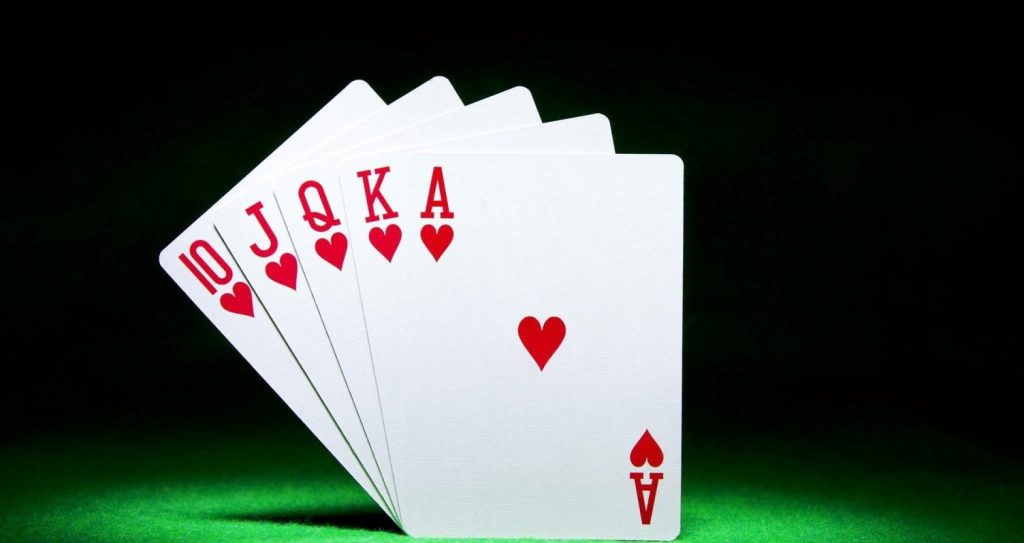 how to play rummy uk 5 cards black and green background